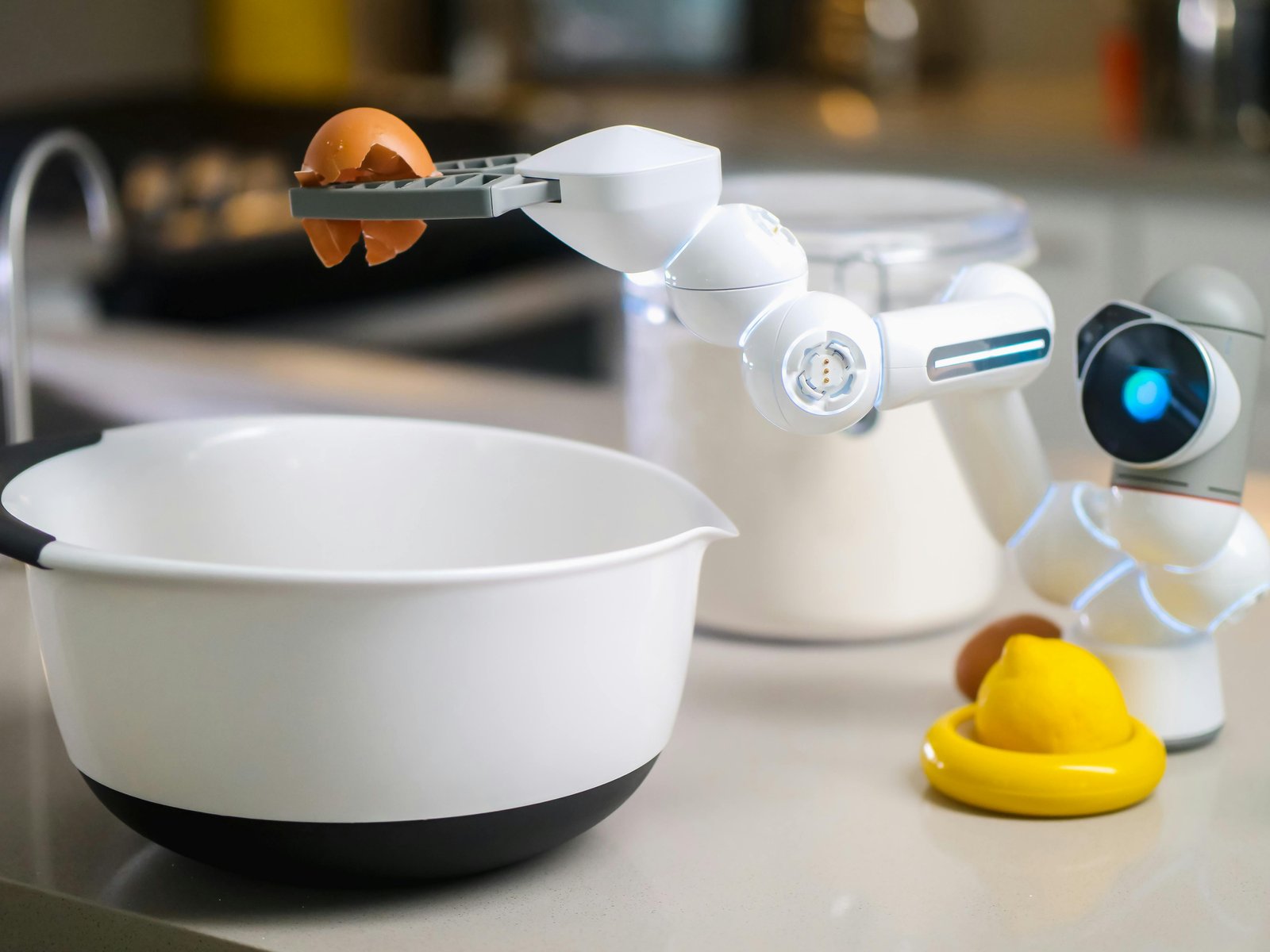 A robotic helper cracks an egg into a bowl in a contemporary kitchen setting, showcasing automation in cooking.
